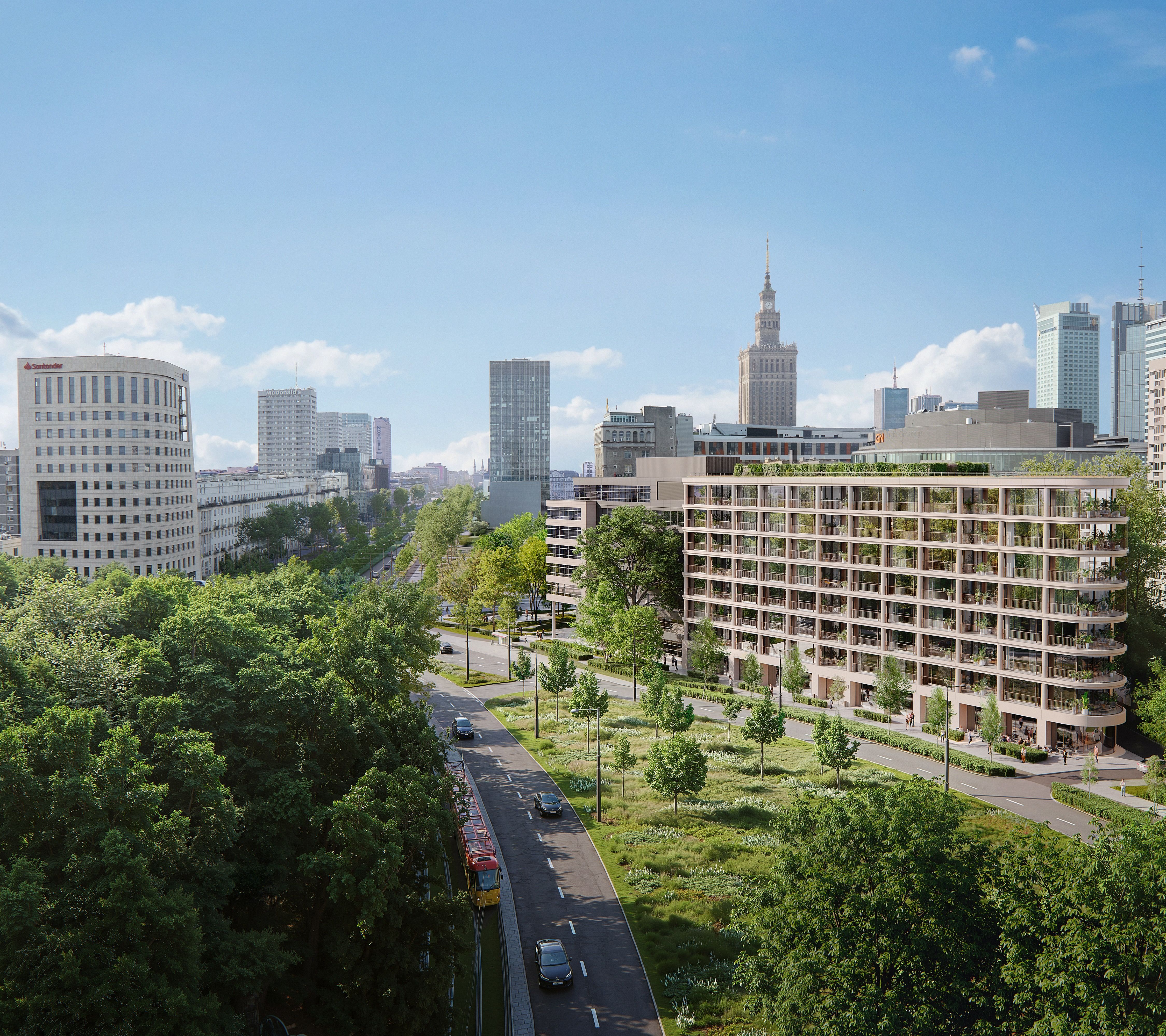 Panoramiczny widok nowoczesnej części miasta w słoneczny dzień. Na pierwszym planie znajduje się szeroka, zadrzewiona aleja z jezdnią i torowiskiem tramwajowym otoczonym bujną zielenią. Po prawej stronie widoczny jest wielopiętrowy budynek mieszkalny z dużymi balkonami i licznymi nasadzeniami roślin. W tle wznoszą się współczesne wieżowce. Nad zabudową rozciąga się bezchmurne, błękitne niebo z pojedynczymi białymi chmurami.